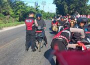 Kasat Samapta Polres Batu Bara Bagikan Bendera Merah Putih, Semangat Nasionalisme dan Kamtibmas
